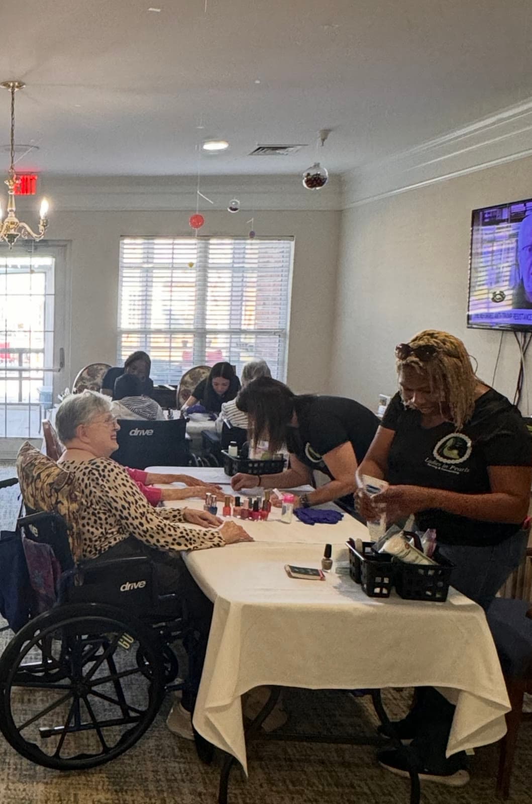 LIPSC volunteer polishing nails for a senior resident