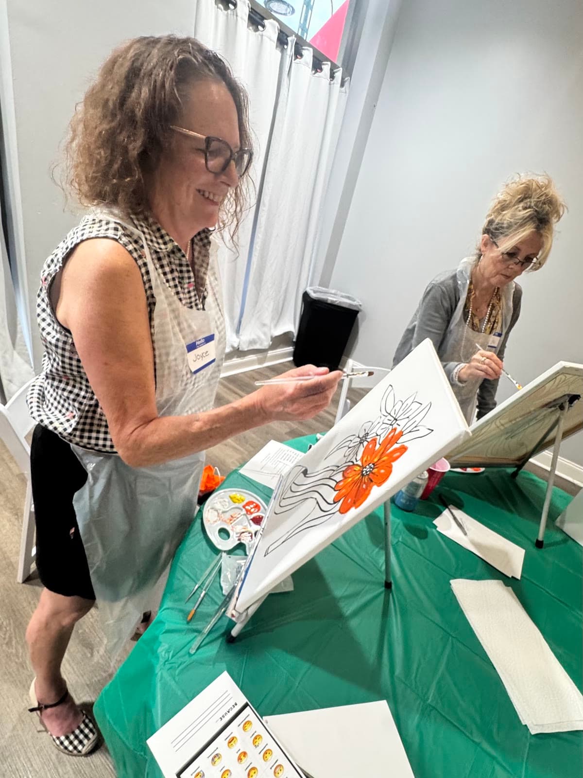 LIPSC members painting at easels during a paint event