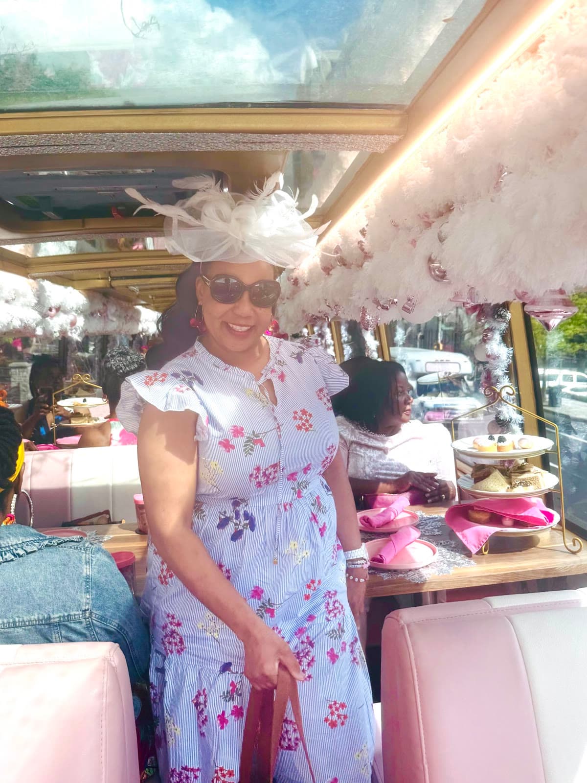 LIPSC member in a floral dress aboard the tea bus