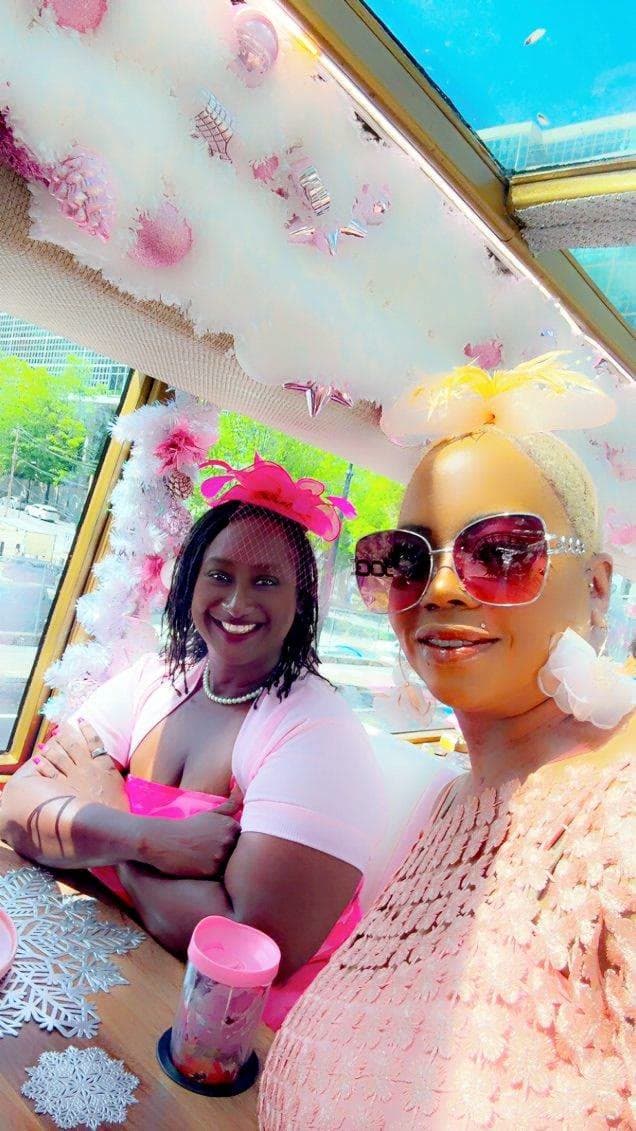 LIPSC members in pink hats aboard the bus